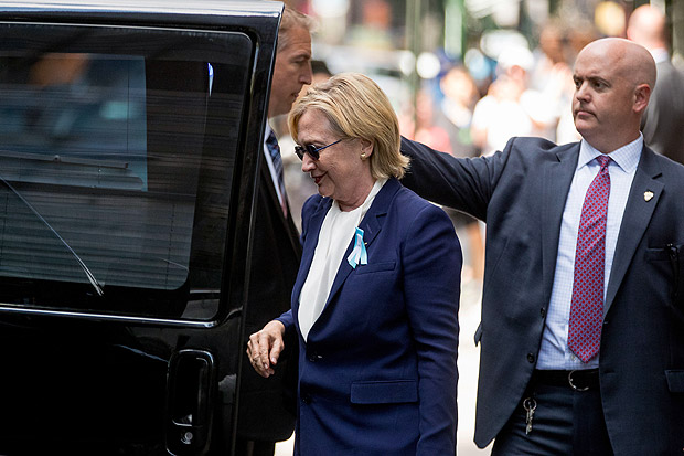Democratic presidential candidate Hillary Clinton gets into a van as she leaves an apartment building Sunday, Sept. 11, 2016, in New York. Clinton's campaign said the Democratic presidential nominee left the 9/11 anniversary ceremony in New York early after feeling "overheated." (AP Photo/Andrew Harnik) ORG XMIT: NYAH120