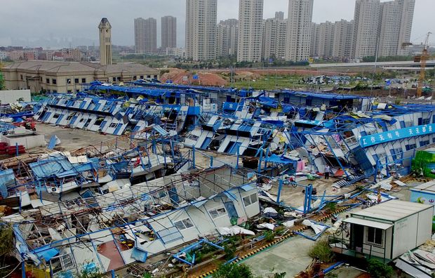 (160915) -- XIAMEN, Sept. 15, 2016 (Xinhua) -- The prefabs for workers at a construction site are damaged by the typhoon Meranti in Xiang'an district of Xiamen, southeast China's Fujian Province, Sept. 15, 2016. Typhoon Meranti made landfall in Xiang'an district of Xiamen City, at 3:05 a.m. Thursday, with gales up to 48 meters per second. (Xinhua/Lin Shanchuan) (zhs)