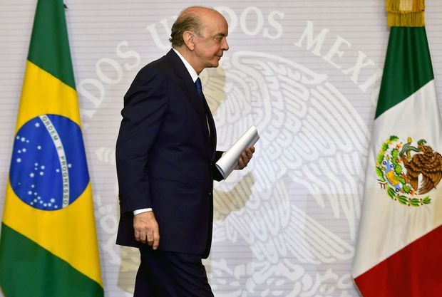 Brazilian Foreign Minister Jose Serra leaves after a joint press conference with his Mexican counterpart Claudia Ruiz Massieu (out of frame) in Mexico City, on July 25, 2016. Serra is on official visit in Mexico. / AFP PHOTO / ALFREDO ESTRELLA ORG XMIT: AES025263