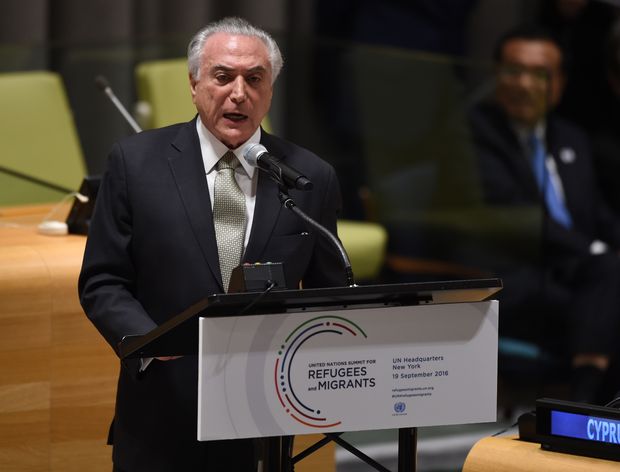 Brazil's President Michel Temer speaks during the High-level plenary meeting on addressing large movements of refugees and migrants in the Trusteeship Council Chamber during the 71st session of the United Nations in New York September 19, 2016. A summit to address the biggest refugee crisis since World War II opens at the United Nations on Monday, overshadowed by the ongoing war in Syria and faltering US-Russian efforts to halt the fighting. World leaders will adopt a political declaration at the first-ever summit on refugees and migrants that human rights groups have already dismissed as falling short of the needed international response. / AFP PHOTO / TIMOTHY A. CLARY ORG XMIT: TC015