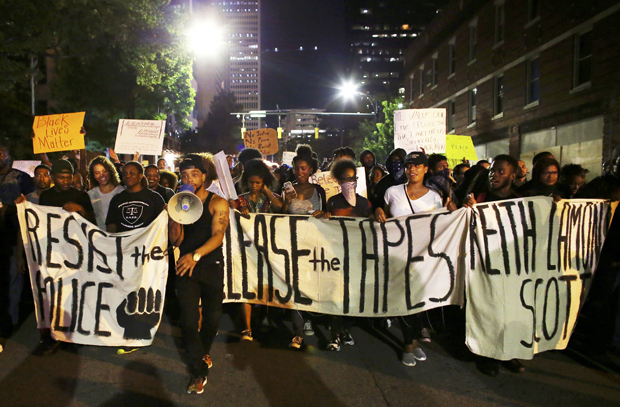 Protesters march during another night of protests over the police shooting of Keith Scott in Charlotte, North Carolina, U.S. September 23, 2016. REUTERS/Mike Blake ORG XMIT: CHA118