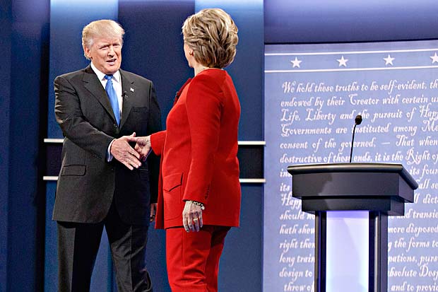 Republican presidential candidate Donald Trump, left, walks to shake hands with Democratic presidential candidate Hillary Clinton before the first presidential debate at Hofstra University, Monday, Sept. 26, 2016, in Hempstead, N.Y. (AP Photo/ Evan Vucci) ORG XMIT: NYEV111