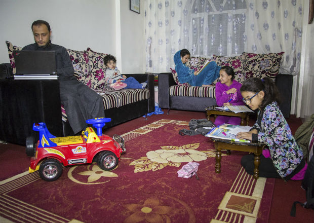 In an undated handout photo, Mohammed al-Asaadi at home with his family. Bombs shake al-Asaadi’s house at night and blow open doors and windows. How can he explain the war in Yemen to his children, who are living through it? (Mohammed al-Asaadi via The New York Times) -- NO SALES; FOR EDITORIAL USE ONLY WITH YEMEN CHILDREN BY MOHAMMED AL-ASAADI FOR OCT. 12, 2016. ALL OTHER USE PROHIBITED.