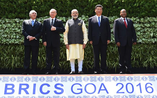 Brazilian President Michel Temer, Russian President Vladimir Putin, Indian Prime Minister Narendra Modi, Chinese President Xi Jinping and South African President Jacob Zuma pose for a group photo during the BRICS Summit in Goa on October 16, 2016. Indian Prime Minister Narendra Modi hosted leaders of the BRICS emerging powers at a summit seeking to boost trade ties and help overcome the bloc's economic woes.