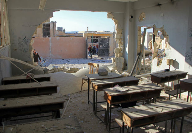 A general view shows a damaged classroom at a school after it was hit in an air strike in the village of Hass, in the south of Syria's rebel-held Idlib province on October 26, 2016. / AFP PHOTO / Omar haj kadour
