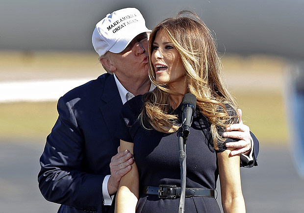 Republican presidential candidate Donald Trump kisses his wife Melania as she introduces him at a campaign rally Saturday, Nov. 5, 2016, in Wilmington, N.C. (AP Photo/John Bazemore) ORG XMIT: NCJB103