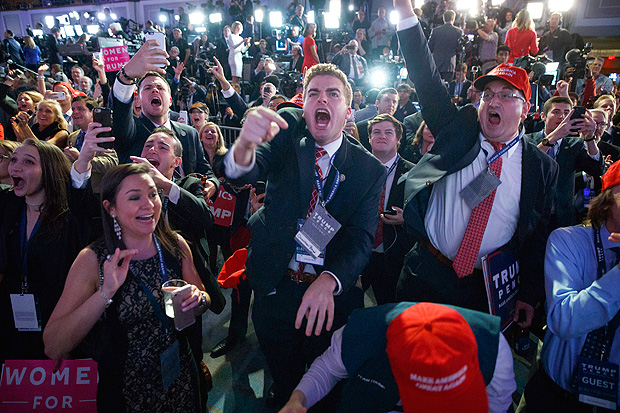Supporters of Republican presidential candidate Donald Trump cheer as they watch election returns during an election night rally, Tuesday, Nov. 8, 2016, in New York. (AP Photo/ Evan Vucci) ORG XMIT: NYEV211