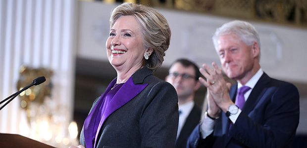 Former President Bill Clinton applauds as his wife, Democratic presidential candidate Hillary Clinton speaks in New York, Wednesday, Nov. 9, 2016. Clinton conceded the presidency to Donald Trump in a phone call early Wednesday morning, a stunning end to a campaign that appeared poised right up until Election Day to make her the first woman elected U.S. president. (AP Photo/Andrew Harnik) ORG XMIT: NYAH203