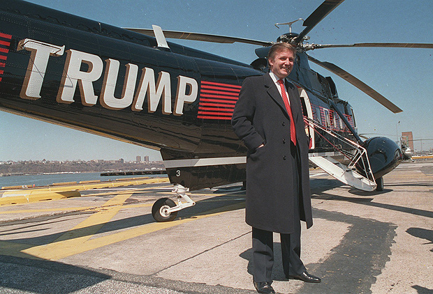 FILE - In this March 1988 file photo, Donald Trump stands next to one of his three Sikorsky helicopters at the New York Port Authority's West 30th Street Heliport in New York. (AP Photo/Wilbur Funches, File) ORG XMIT: NY567