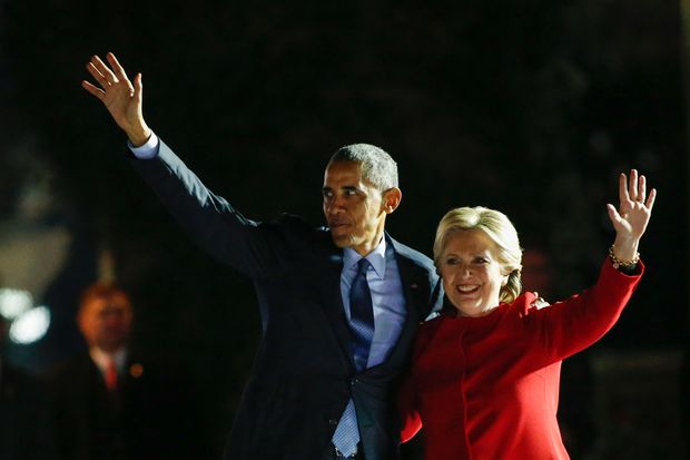 Democratic presidential nominee Hillary Clinton and US President Barack Obama wave from the stage during an election campaign rally on November 7, 2016 in Philadelphia. About 40,000 people flooded Independence Mall in Philadelphia for Hillary Clinton's rally with her husband Bill, President Barack Obama and his wife Michelle at her side, a campaign aide said. The attendance set a new record for Clinton, with the previous high point a rally in Ohio that drew 18,500 people, a campaign aide told reporters traveling with the candidate. 