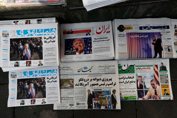  A picture taken on November 10, 2016 in the Iranian capital Tehran shows local newspapers displaying articles on US president-elect Donald Trump a day after his election. Iran's President Hassan Rouhani said on November 9 there was 