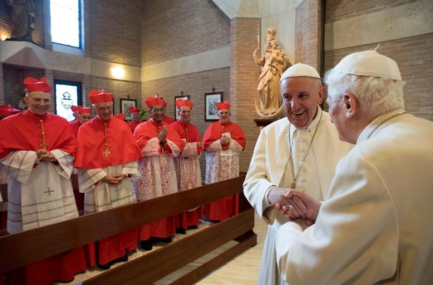 Pope Francis, second left, talks with Pope Emeritus Benedict XVI in the former Convent Mater Ecclesiae at the Vatican, Saturday, Nov. 19, 2016. After the basilica ceremony, the new cardinals and Pope Francis took two mini-buses to the monastery on Vatican grounds where Benedict lives to greet the emeritus pontiff. (L'Osservatore Romano/pool photo via AP) ORG XMIT: OSS104