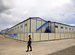 A Philippine army soldier walks outside of a drug abuse treatment and rehabilitation center which was inaugurated inside the military headquarters in Fort Magsaysay, in the Nueva Ecija province, north of Manila,