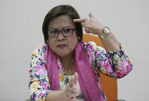 n this Sept. 7, 2016 photo, Philippine Senator Leila de Lima gestures during an interview in Pasay, south of Manila, Philippines. De Lima launched a congressional probe into reports of extrajudicial killings and called Harra Kazuo to testify in August, Philippine President Rodrigo Duterte suggested she resign and hang herself. Kazuo's live-in partner was allegedly shot to death by police with her father-in-law following a drug raid which is part of the continuing anti-drugs campaign of Duterte. (AP Photo/Aaron Favila) ORG XMIT: XAF109