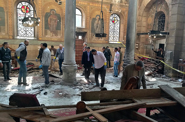 Egyptian security forces examine the scene inside St. Mark Cathedral in central Cairo, following a bombing, Sunday, Dec. 11, 2016. The blast at Egypt's main Coptic Christian cathedral killed dozens of people and wounded many others on Sunday, according to Egyptian state television, making it one of the deadliest attacks carried out against the religious minority in recent memory. (Omar El-Hady via AP) ORG XMIT: CAI106