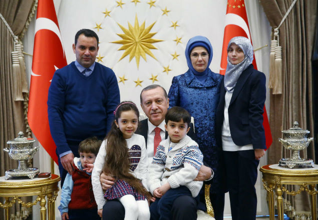 Turkish President Tayyip Erdogan, accompanied by his wife Emine Erdogan, meets with Syrian girl Bana Alabed, known as Aleppo's tweeting girl, and her family at the Presidential Palace in Ankara, Turkey, December 21, 2016. Kayhan Ozer/Presidential Palace/Handout via REUTERS ATTENTION EDITORS - THIS PICTURE WAS PROVIDED BY A THIRD PARTY. FOR EDITORIAL USE ONLY. NO RESALES. NO ARCHIVE. ORG XMIT: IST03