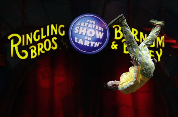 A Ringling Bros. and Barnum & Bailey clown does a somersault during a performance Saturday, Jan. 14, 2017, in Orlando, Fla. The Ringling Bros. and Barnum & Bailey Circus will end the "The Greatest Show on Earth" in May, following a 146-year run of performances. Kenneth Feld, the chairman and CEO of Feld Entertainment, which owns the circus, told The Associated Press, declining attendance combined with high operating costs are among the reasons for closing. (AP Photo/Chris O'Meara) ORG XMIT: FLCO104