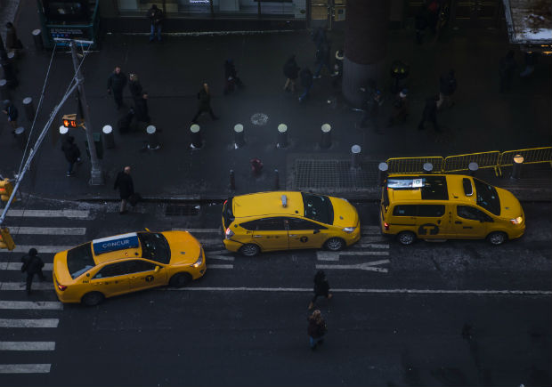 Yellow taxi cabs during rush hour in Midtown Manhattan, Jan. 10, 2017. Yellow cabs, once seen as a fixture of New York City life, have lost significant ground to a growing fleet of black cars summoned by ride-hailing apps with short, catchy names and loyal followings. (Hiroko Masuike/The New York Times)