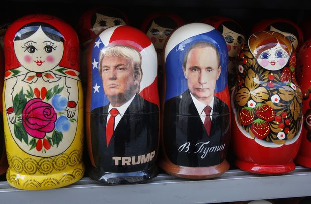 Traditional Russian wooden dolls called Matryoshka depicting Russian President Vladimir Putin and Donald Trump, hours before Donald Trump is to be sworn in as president of the United States, are displayed for sale at a street souvenir shop in St. Petersburg, Russia, Friday, Jan. 20, 2017.