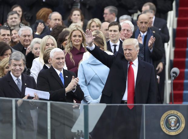 U.S. President-elect Donald Trump waves as he arrives to be inaugurated during ceremonies on the Capitol in Washington, U.S., January 20, 2017.