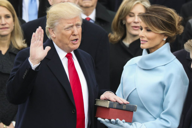  Donald Trump is sworn in as the 45th president of the United States as Melania Trump looks on during the 58th Presidential Inauguration at the U.S. Capitol in Washington, Friday, Jan. 20, 2017. (AP Photo/Andrew Harnik) ORG XMIT: DCDA129