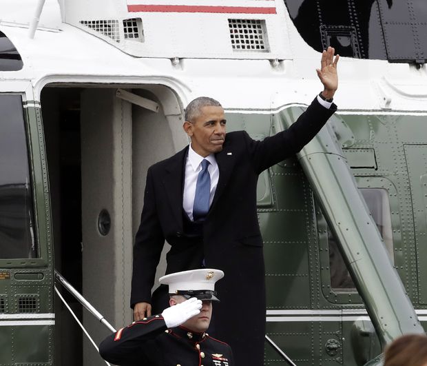 Former President Barack Obama waves as he boards a Marine helicopter during a departure ceremony on the East Front of the U.S. Capitol in Washington, Friday, Jan. 20, 2017, after President Donald Trump was inaugurated.