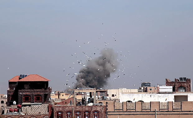 Debris and smoke rise after a Saudi-led airstrike hit an army base, in Sanaa, Yemen, Sunday, Jan. 22, 2017. (AP Photo/Hani Mohammed) ORG XMIT: AHM101
