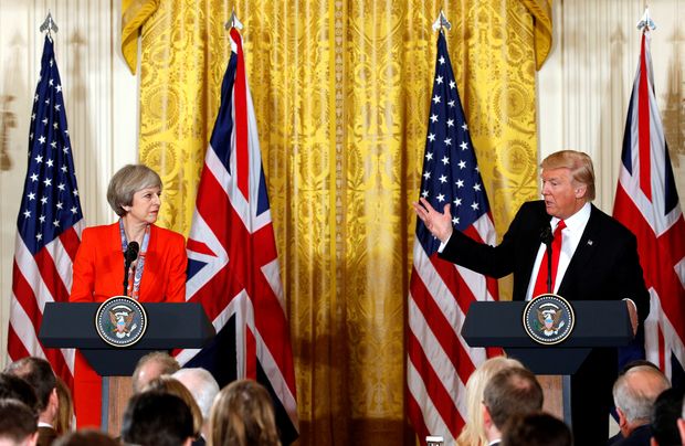 British Prime Minister Theresa May listens as U.S. President Donald Trump speaks during their joint news conference at the White House in Washington, U.S., January 27, 2017.