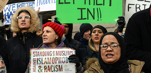 NEW YORK, NY - JANUARY 28: Protestors rally during a protest against the Muslim immigration ban at John F. Kennedy International Airport on January 28, 2017 in New York City. President Trump singed the controversial executive order that halted refugees and residents from predominantly Muslim countries from entering the United States. Stephanie Keith/Getty Images/AFP == FOR NEWSPAPERS, INTERNET, TELCOS & TELEVISION USE ONLY ==