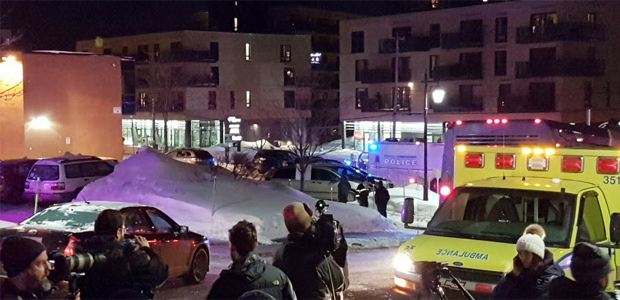 An ambulance is parked at the scene of a fatal shooting at the Quebec Islamic Cultural Centre in Quebec City, Canada January 29, 2017. REUTERS/Mathieu Belanger ORG XMIT: QUE101