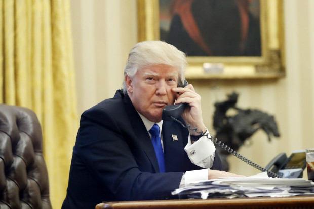 FILE - In this Jan. 28, 2017, file photo, U.S. President Donald Trump speaks on the phone with Prime Minister of Australia Malcolm Turnbull in the Oval Office of the White House in Washington. For decades, Australia and the U.S. have enjoyed the coziest of relationships, collaborating on everything from military and intelligence to diplomacy and trade. Yet an irritable tweet President Donald Trump fired off about Australia and a dramatic report of an angry phone call between the nations' leaders proves that the new commander in chief has changed the playing field for even America's staunchest allies. (AP Photo/Alex Brandon, File) ORG XMIT: BKCD401