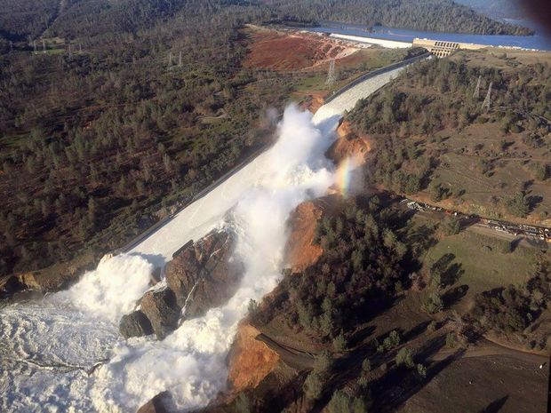  A damaged spillway with eroded hillside is seen in an aerial photo taken over the Oroville Dam in Oroville, California, U.S. February 11, 2017. California Department of Water Resources/William Croyle/Handout via REUTERS ATTENTION EDITORS - THIS IMAGE WAS PROVIDED BY A THIRD PARTY. EDITORIAL USE ONLY. THIS PICTURE WAS PROCESSED BY REUTERS TO ENHANCE QUALITY. AN UNPROCESSED VERSION HAS BEEN PROVIDED SEPARATELY. TPX IMAGES OF THE DAY ORG XMIT: SEA100R