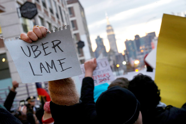 People gather to protest outside the Uber offices in Queens, New York, U.S., February 2, 2017. REUTERS/Brendan McDermid ORG XMIT: NYK505