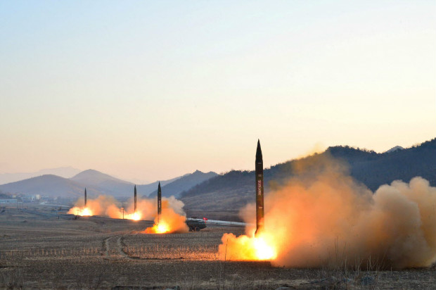 FILE PHOTO: North Korean leader Kim Jong Un supervised a ballistic rocket launching drill of Hwasong artillery units of the Strategic Force of the KPA on the spot in this undated photo released by North Korea's Korean Central News Agency (KCNA) in Pyongyang March 7, 2017. To match Analysis NORTHKOREA-MISSILES/DEFENCE KCNA/via REUTERS/File Photo ATTENTION EDITORS - THIS PICTURE WAS PROVIDED BY A THIRD PARTY. REUTERS IS UNABLE TO INDEPENDENTLY VERIFY THE AUTHENTICITY, CONTENT, LOCATION OR DATE OF THIS IMAGE. FOR EDITORIAL USE ONLY. NOT FOR SALE FOR MARKETING OR ADVERTISING CAMPAIGNS. NO THIRD PARTY SALES. NOT FOR USE BY REUTERS THIRD PARTY DISTRIBUTORS. SOUTH KOREA OUT. NO COMMERCIAL OR EDITORIAL SALES IN SOUTH KOREA. ORG XMIT: RPA356
