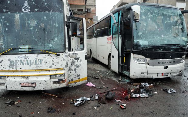 (170311) -- DAMASCUS, March 11, 2017 (Xinhua) -- Photo taken on March 11, 2017 shows scene after blasts targeting Iraqi Shiite visitors in Damascus, capital of Syria. At least 40 people were killed and 100 others wounded on Saturday when explosive devices ripped through busses carrying Shiite visitors close to the Shaghour area in the capital Damascus, a well-informed security source told Xinhua. (Xinhua/Ammar Safarjalani