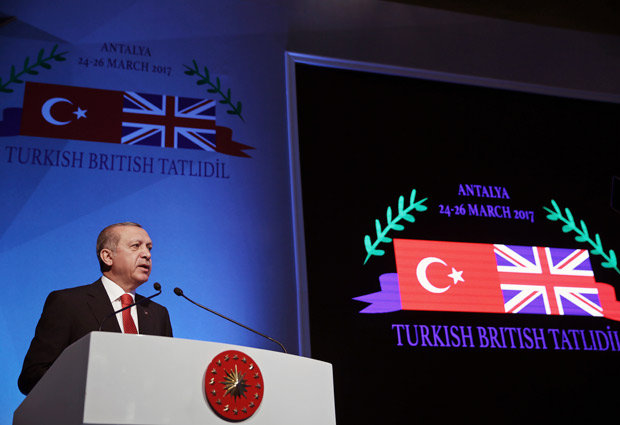 Turkey's President Recep Tayyip Erdogan speaks during a Turkish-U.K. forum in Antalya, Turkey, Saturday, March 25, 2017. Erdogan said Saturday the country might pursue a Brexit-like referendum on whether to pursue European Union membership and also lashed out at a critical protest in Switzerland. (Yasin Bulbul/Presidential Press Service, Pool Photo via AP) ORG XMIT: ANK110
