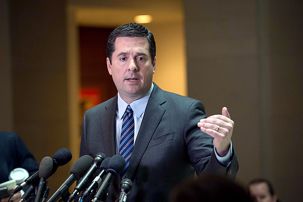 (FILES) This file photo taken on March 24, 2017 shows US Representative from California Devin Nunes, chairman of the House Intelligence Committee,as he speaks to the press about the investigation of Russian meddling in the 2016 presidential election on Capitol Hill in Washington, DC. The Republican leader of the House investigation into Russian interference in the US election announced on April 6, 2017 he was stepping aside after being criticized for being too close to President Donald Trump. Devin Nunes, the chairman of the House Intelligence Commitee, had come under fire for briefing Trump on information he had received while keeping members of his own committee in the dark. / AFP PHOTO / NICHOLAS KAMM ORG XMIT: NK2472
