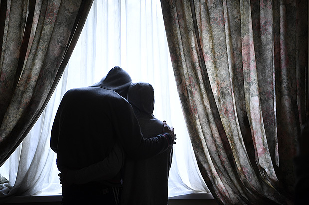Ilya and Nohcho, gay men from Chechnya who use pseudonyms for safety, in a safe house in Moscow, April 19, 2017. The targeted, collective trapping and torturing of gays that began this month in Chechnya is a new, dark turn in the region's long history of rights abuses. "I don't blame him," Nohcho said of the friend who informed on him. "We are not heroes. We're just gay guys. They starve you. They shock you." (James Hill/The New York Times) 
