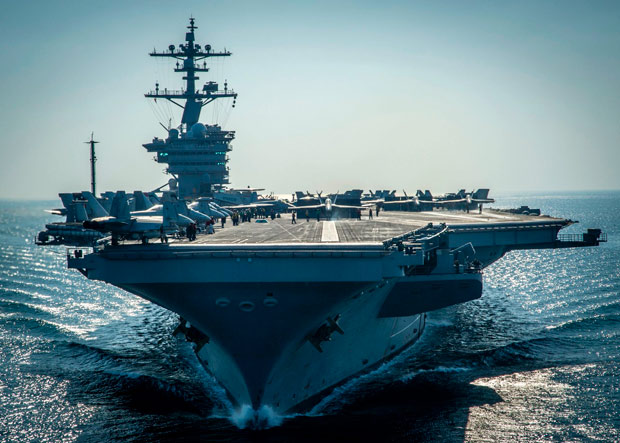 (FILES): This December 8, 2014 file photo shows the Nimitz-class aircraft carrier USS Carl Vinson (CVN 70) preparing for flight operations in the Arabian Gulf. The US Navy announced April 15, 2017 it had sent the USS Carl Vinson to the Korean peninsula in a show of force against North Korea's "reckless" nuclear weapons program. "US Pacific Command ordered the Carl Vinson Strike Group north as a prudent measure to maintain readiness and presence in the Western Pacific," said Commander Dave Benham, spokesman at US Pacific Command. / AFP PHOTO / Navy Media Content Services / MC2 Scott Fenaroli ORG XMIT: USS Carl Vinson (CVN 70)