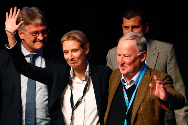 Alice Weidel (2nd L) and Alexander Gauland (R) celebrate their nomination as campaign leaders of Germany's right-wing populist Alternative for Germany (AfD) party for the next German general election, during the party congress at the Maritim Hotel in Cologne, western Germany, on April 23, 2017. The anti-immigration party, which hopes to win its first seats in the national parliament in a general election in September, gathers in the western city of Cologne on April 22-23, 2017. / AFP PHOTO / Odd ANDERSEN