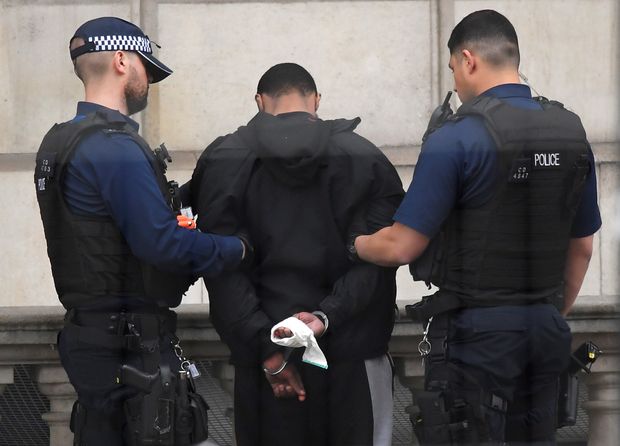 A man is held by police in Westminster after an arrest was made on Whitehall in central London, Britain, April 27, 2017. REUTERS/Toby Melville ORG XMIT: LON222