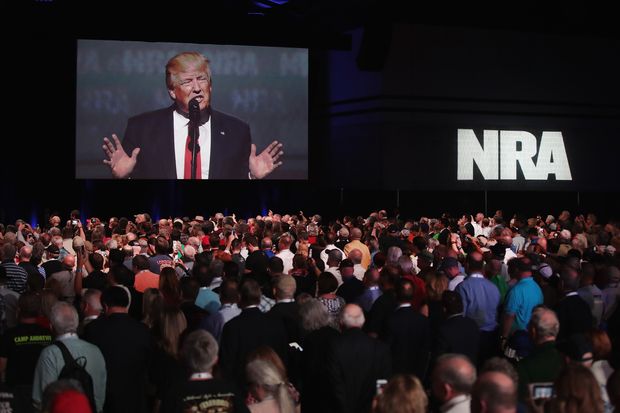ATLANTA, GA - APRIL 28: President Donald Trump speaks at the NRA-ILA's Leadership Forum at the 146th NRA Annual Meetings & Exhibits on April 28, 2017 in Atlanta, Georgia. The convention is the largest annual gathering for the NRA's more than 5 million members. Trump is the first president to address the annual meetings since Ronald Reagan. Scott Olson/Getty Images/AFP == FOR NEWSPAPERS, INTERNET, TELCOS & TELEVISION USE ONLY ==
