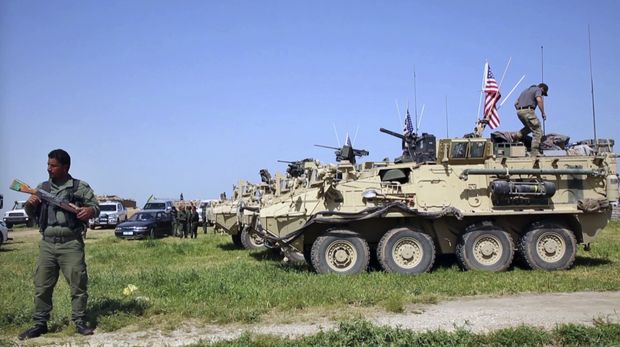 Frame de vdeo divulgado pela milcia curda YPG (Unidades de Proteo Popular) mostra blindados dos EUA