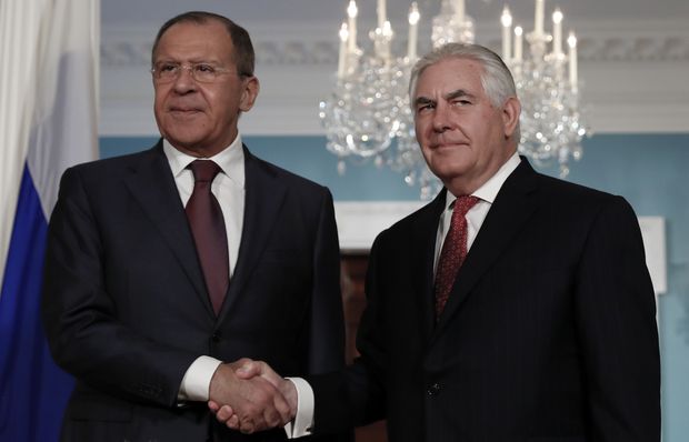 Secretary of State Rex Tillerson, right, shakes hands with Russian Foreign Minister Sergey Lavrov at the State Department in Washington, Wednesday, May 10, 2017. (AP Photo/Carolyn Kaster)