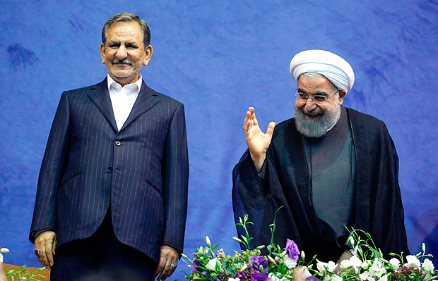 Iranian President and presidential candidate Hassan Rouhani (R), along with current vice-president and presidential candidate Eshaq Jahangiri, attend a campaign rally for the upcoming presidential elections in the capital Tehran on May 13, 2017. / AFP PHOTO / ATTA KENARE ORG XMIT: AK2581
