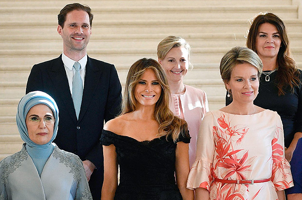 (Front row LtoR) First Lady of Turkey Emine Gulbaran Erdogan, First Lady of the US Melania Trump, Queen Mathilde of Belgium, (back row, LtoR) First Gentleman of Luxembourg Gauthier Destenay, partner of Slovenia's Prime Minister Mojca Stropnik and First Lady of Iceland Thora Margret Baldvinsdottir pose for a family photo before a diner of the First Ladies and Queen at the Royal castle in Laken/Laeken, on May 25, 2017, in Brussels. / AFP PHOTO / BELGA / YORICK JANSENS / Belgium OUT