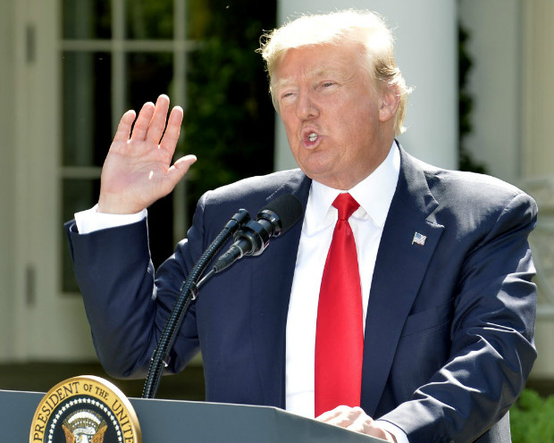 (170601) -- WASHINGTON, June 1, 2017 (Xinhua) -- U.S. President Donald Trump gestures as he delivers a speech at the White House in Washington D.C., capital of the United States, on June 1, 2017. U.S. President Donald Trump said on Thursday that he has decided to pull the United States out of the Paris Agreement, a landmark global pact to fight climate change. (Xinhua/Mike Theiler)