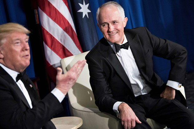 (FILES) A file photo tsken on May 4, 2017, shows Australia's Prime Minister Malcolm Turnbull (R) listening as US President Donald Trump makes a statement to the press before a meeting on board the Intrepid Sea, Air and Space Museum in New York, New York. Turnbull has taken a comical swipe at Trump, mimicking the US president's mannerisms and even making reference to the Russia scandal. In a leaked audio recording from a closed event for journalists in Canberra on June 14, 2017, Turnbull is heard making fun of Trump, picking up on common language from the US president's vocabulary. / AFP PHOTO / BRENDAN SMIALOWSKI