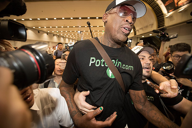 Former NBA basketball player Dennis Rodman arrives at Beijing Capital International Airport in Beijing, Saturday, June 17, 2017, after a flight from Pyongyang. Former NBA star Rodman, vowing to come back again soon, on Saturday wrapped up a low-key and incident-free visit to the North Korean capital. (AP Photo/Mark Schiefelbein) ORG XMIT: XMAS101