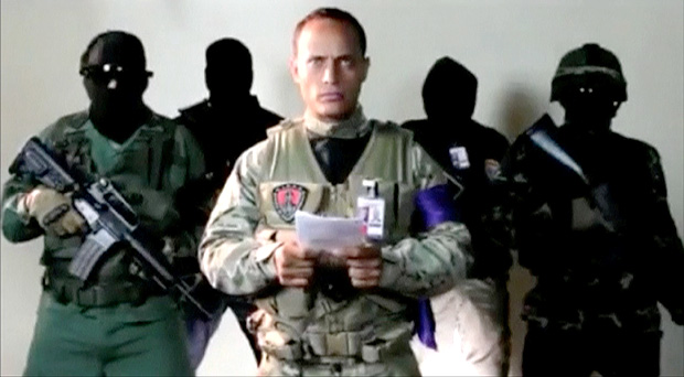 Investigative police pilot Oscar Perez reads a statement from an undisclosed location June 27, 2017, in this still image taken from a video. Mandatory credit @OSCARPEREZGV INSTAGRAM - MUST COURTESY INSTAGRAM/@OSCARPEREZGOV/Handout via REUTERS ATTENTION EDITORS - THIS IMAGE HAS BEEN SUPPLIED BY A THIRD PARTY. NO RESALES. NO ARCHIVE. MUST COURTESY INSTAGRAM /@OSCARPEREZGOV. ORG XMIT: SIN302